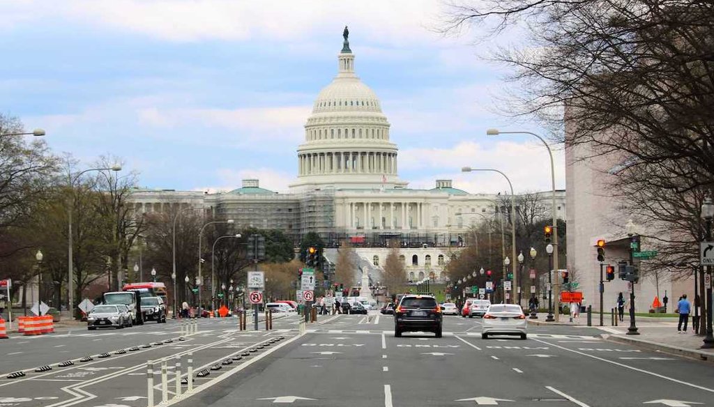 Street traffic passes the Capitol building in Washington, D.C., March 25, 2022 (Gabrielle Settles, PolitiFact)