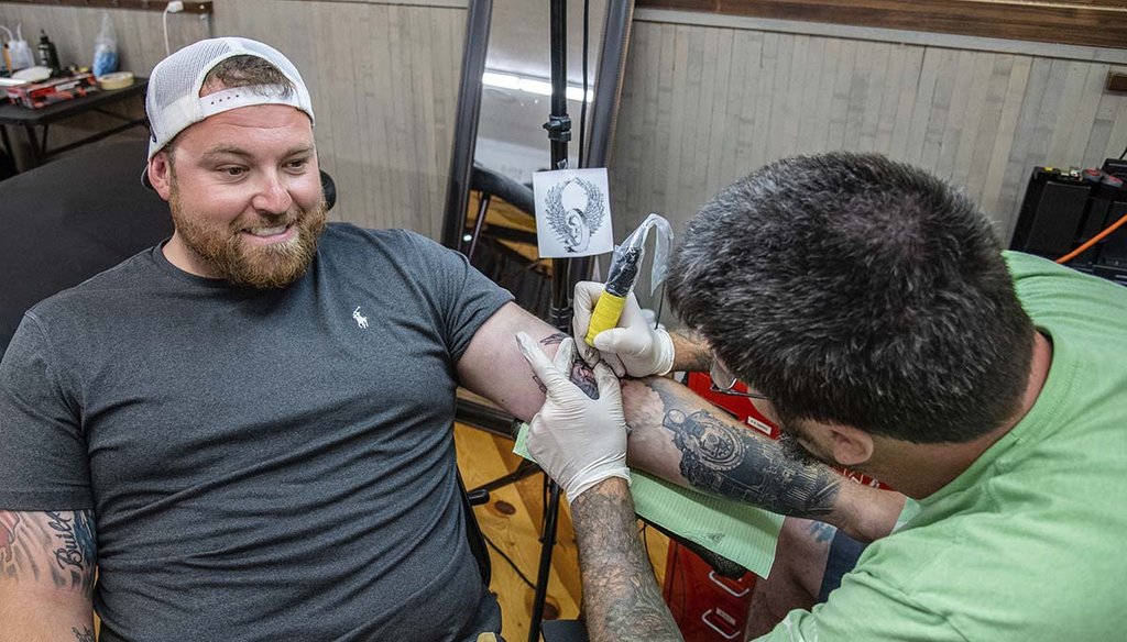 Brandon Taranto receives a tattoo during the 80th annual Sturgis Motorcycle Rally on Aug. 14, 2020, in Sturgis, S.D. (AP)