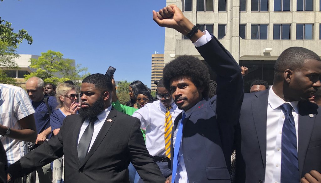 Justin Pearson celebrates with supporters April 12, 2023, after being reinstated to the the Tennessee House of Representatives by the Shelby County Board of Commissioners building in Memphis, Tenn. (AP)