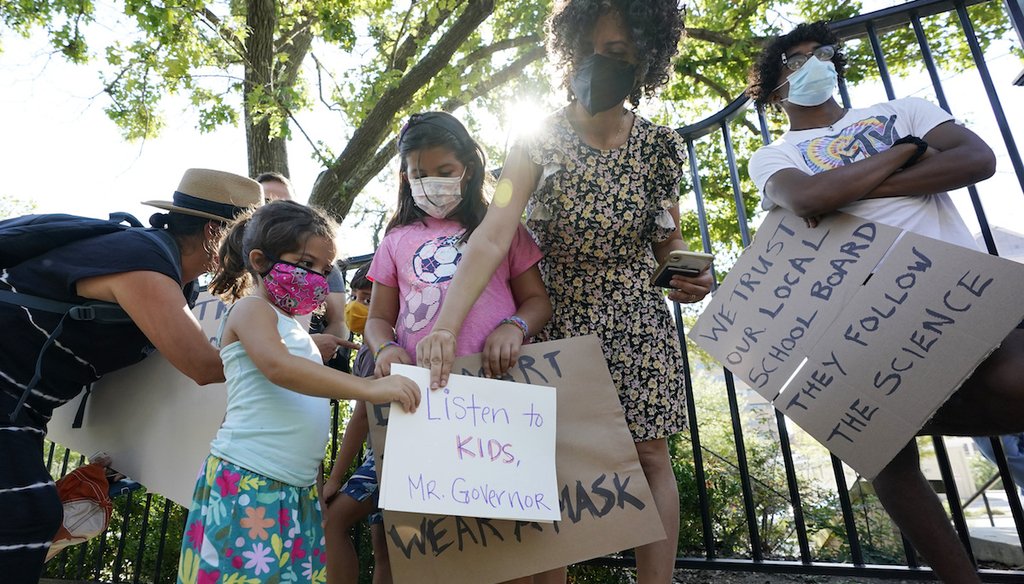 Students and parents gather outside the Governor's Mansion to urge Texas Gov. Greg Abbott to drop his opposition to public school mask mandates on Aug. 16, 2021. (AP)