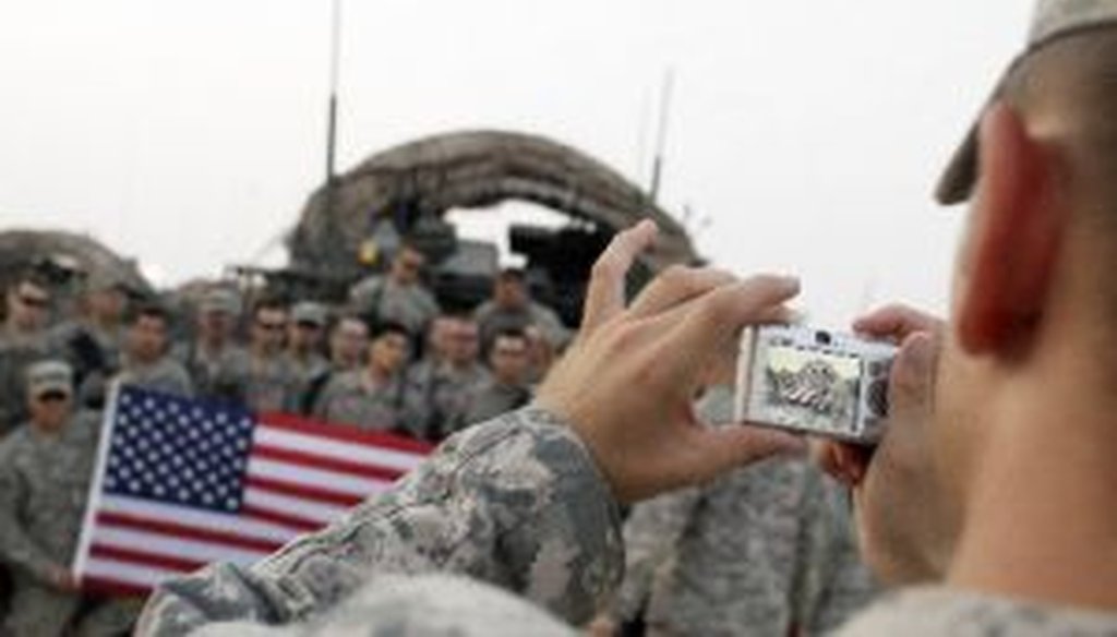 U.S. Army soldiers pose for a photo after crossing the border from Iraq into Kuwait on Aug. 16.