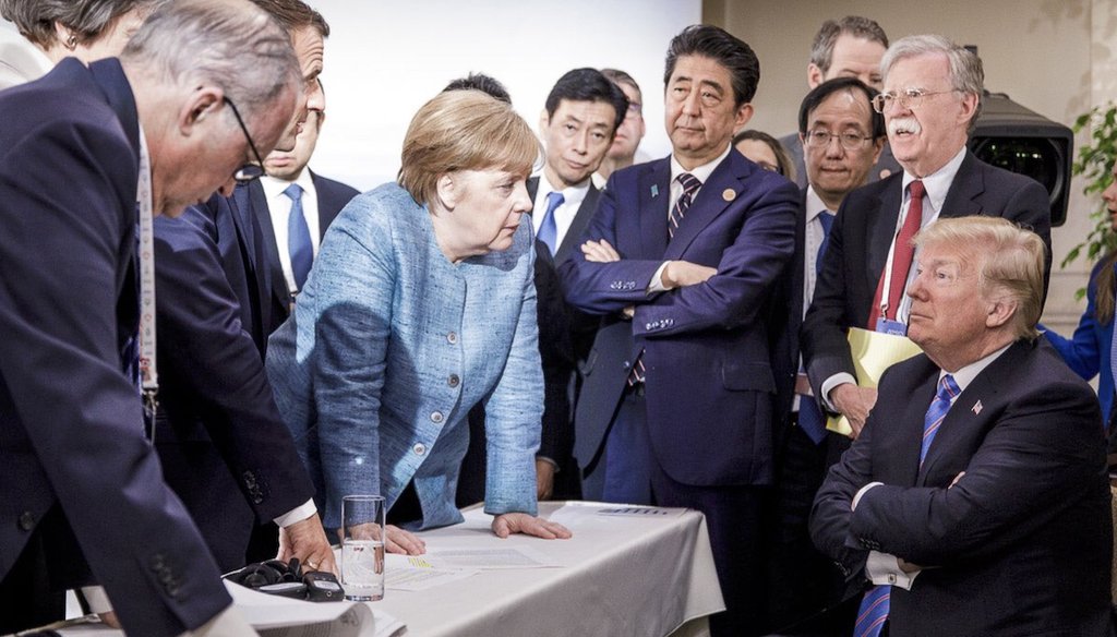 In this June 9, 2018, file photo, then-President Donald Trump speaks with world leaders during the G7 Leaders Summit in Quebec, Canada. (German Federal Government via AP)