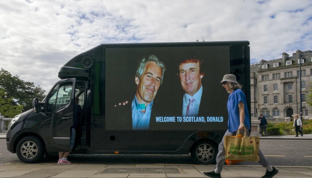 A photograph of US President Donald Trump and Jeffrey Epstein is displayed on the side of a van in Aberdeen city centre, during US President Donald Trump’s five-day private trip to Scotland, Monday, July 28, 2025. (AP)