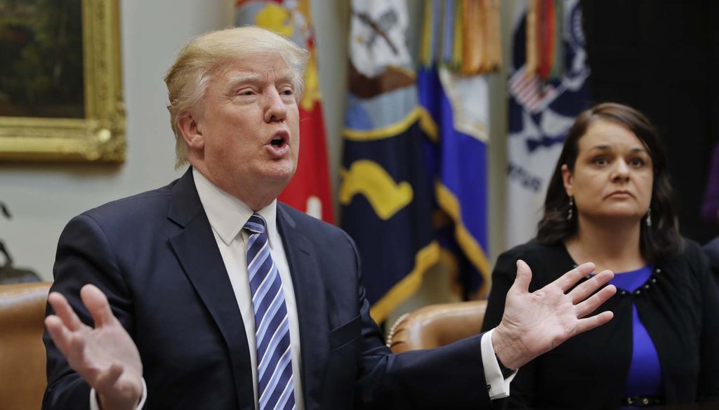 Carrie Couey, from Colorado, listens at right as President Donald Trump speaks during a meeting on health care in the Roosevelt Room of the White House on March 13, 2017. (AP Photo/Pablo Martinez Monsivais)