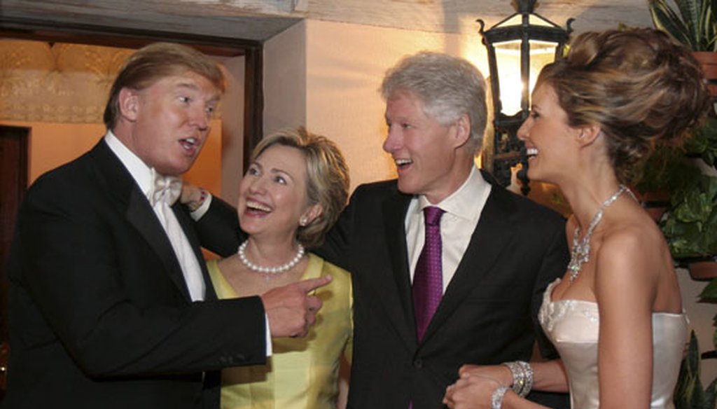 Bill and Hillary Clinton chat with Donald Trump during the reception for his wedding to Melania Knauss in Palm Beach, Fla., on Jan. 22, 2005. (Getty Images)