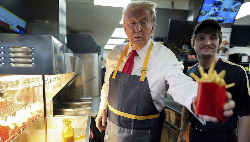 President-elect Donald Trump, left, hands off an order of fries alongside an employee during a visit to McDonald's in Feasterville-Trevose, Pa., Oct. 20, 2024. (AP)