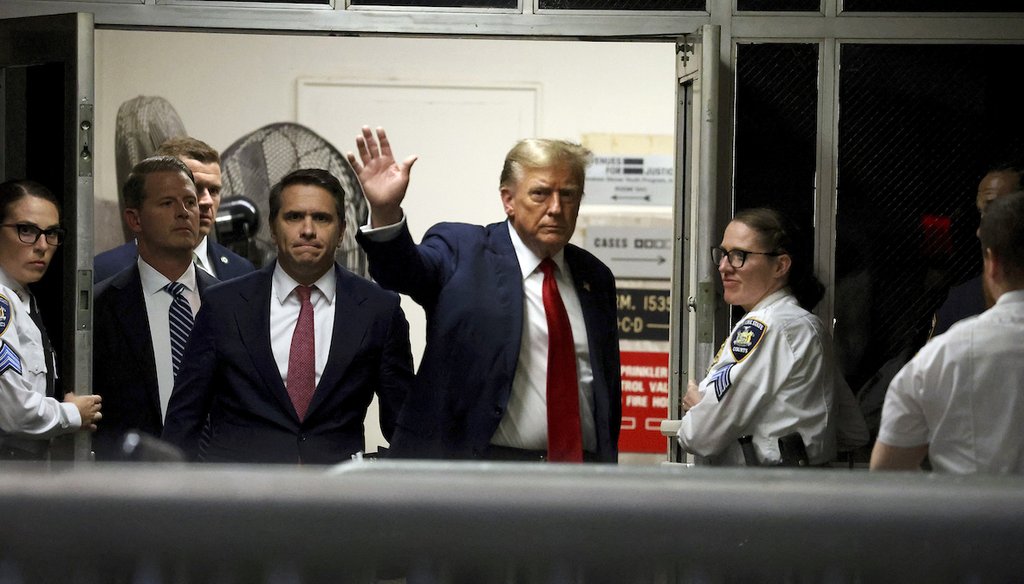Former President Donald Trump waves as he returns from a break back to State Supreme Court in Manhattan, on April 15, 2024, in New York. (New York Times/AP)