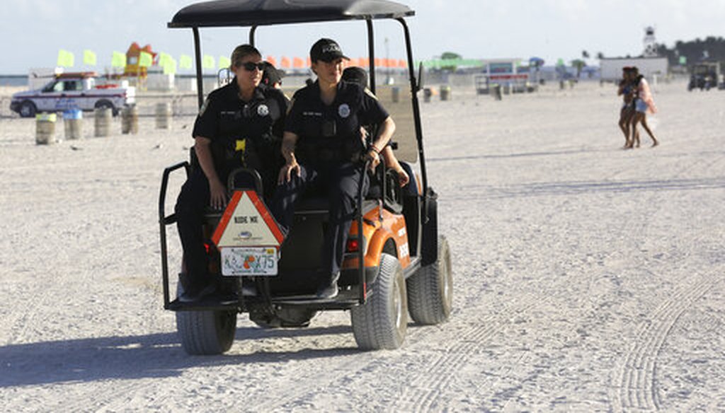 Miami Beach police officers patrol on the beach during spring break, Saturday, March 14, 2020, in Miami Beach, Fla. Portions of South Beach were closed late Saturday to avoid large group gatherings that could spread the coronavirus. (AP)