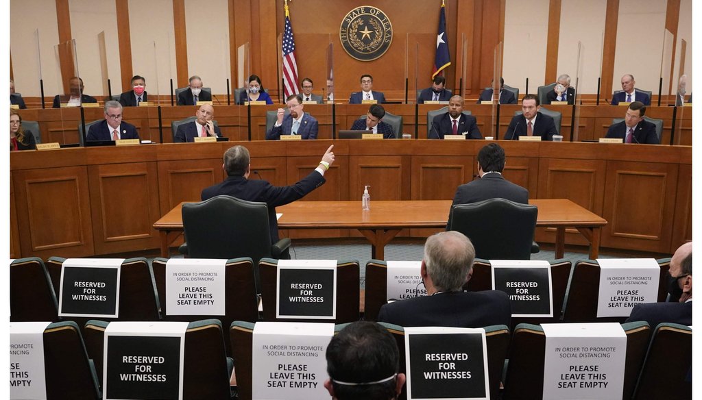 Curtis Morgan, the CEO of Vistra Corp., at table left, testifies as the Committees on State Affairs and Energy Resources holds a joint public hearing to consider the factors that led to statewide electrical blackouts, Feb. 25, 2021, in Austin, Texas (AP)