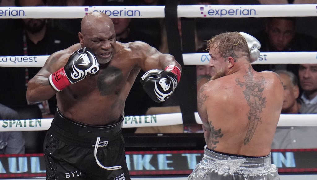 Mike Tyson, left, fights Jake Paul during their heavyweight boxing match Nov. 15, 2024, in Arlington, Texas. (AP)