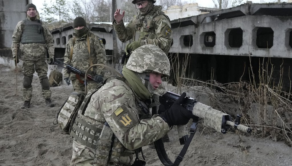 Members of Ukraine's Territorial Defense Forces, volunteer units of the Armed Forces, train close to Kyiv, Jan. 29, 2022. Dozens of civilians have been joining Ukraine's army reserves in recent weeks amid fears about Russian invasion. (AP)