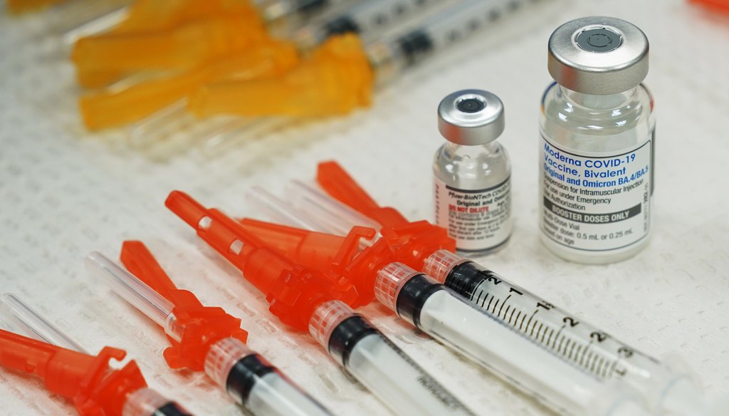 Pfizer, left, and Moderna bivalent COVID-19 vaccines are readied for use at a clinic Nov. 17, 2022, in Richmond. Va. (AP)