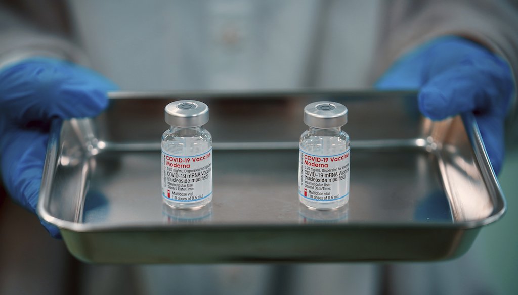 Vials of the Moderna COVID-19 vaccine are placed in a tray at a vaccination center in Tokyo on Jan. 22, 2022. (AP)