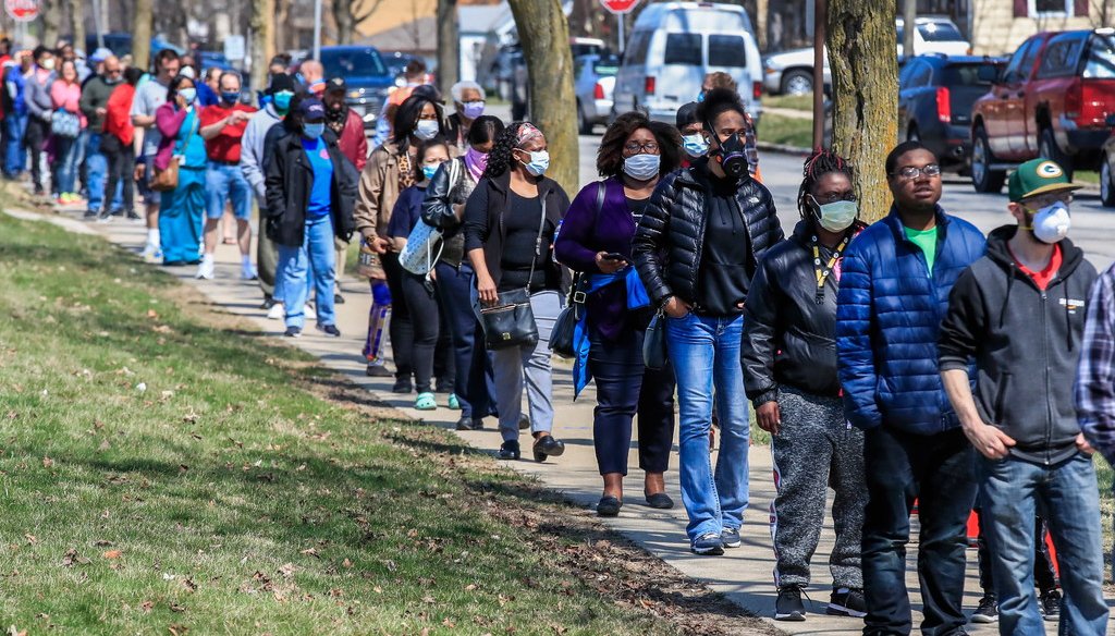 Voters wait in line to cast their ballots in the Wisconsin presidential primary election at Marshall High School in Milwaukee. (EPA-EFE/TANNEN MAURY)