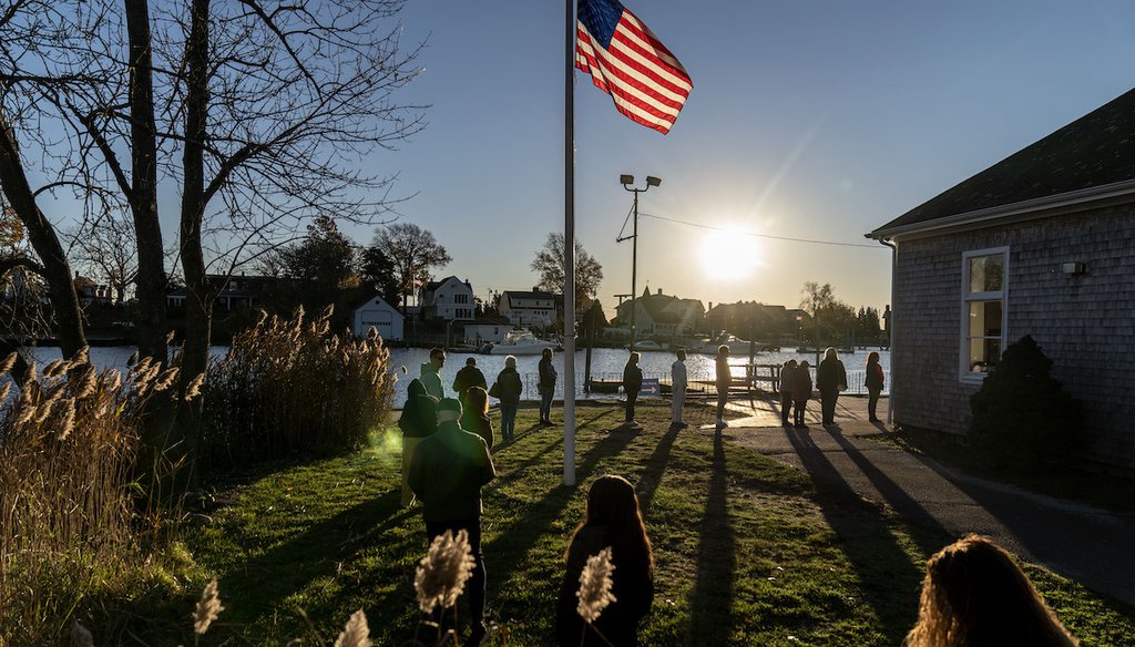 Voters line up to cast their ballots in the midterm election at the Aspray Boat House in Warwick, R.I., Tuesday, Nov. 8, 2022. (AP)