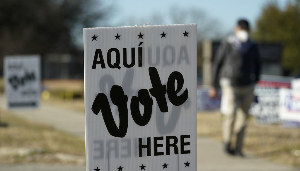 A file photo shows a sign pointing people to a polling place in San Antonio, Texas during early voting in the primary election, Feb. 14, 2022. (AP)
