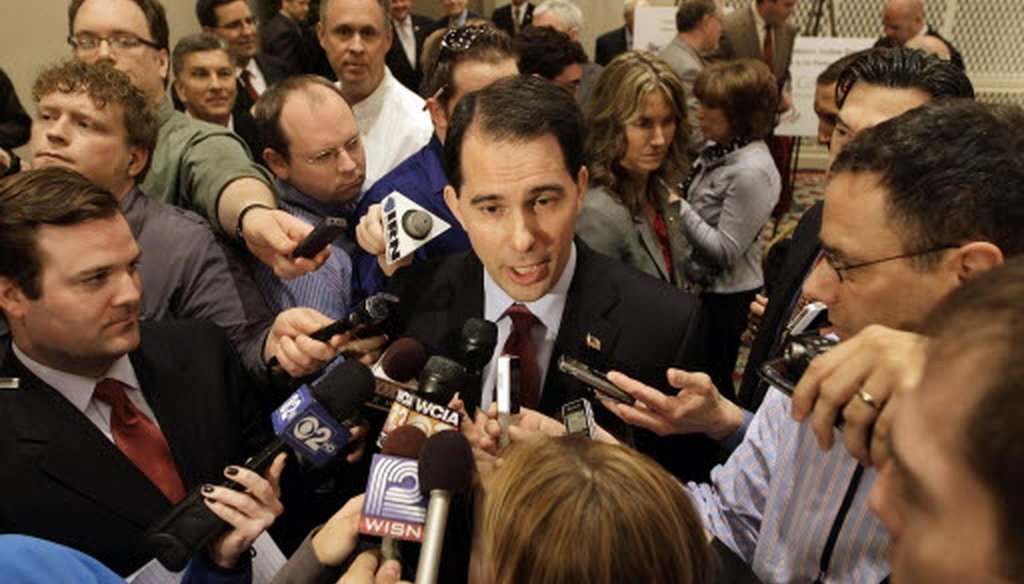 Gov. Scott Walker addresses the media after speaking to the Illinois Chamber of Commerce in Springfield, Ill.