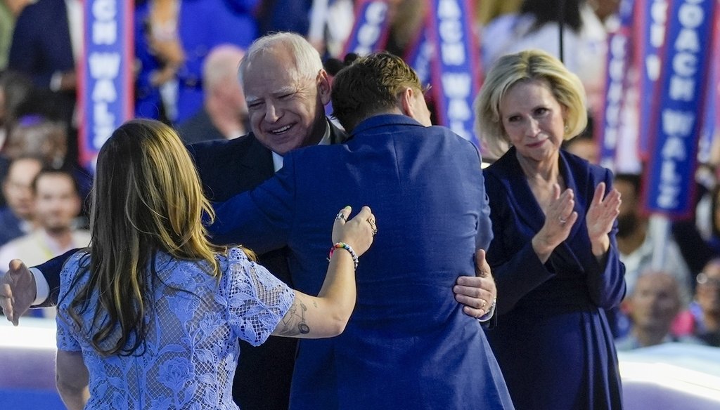 Democratic vice presidential nominee Minnesota Gov. Tim Walz hugs his family Aug. 21, 2024, during the Democratic National Convention in Chicago. (AP)