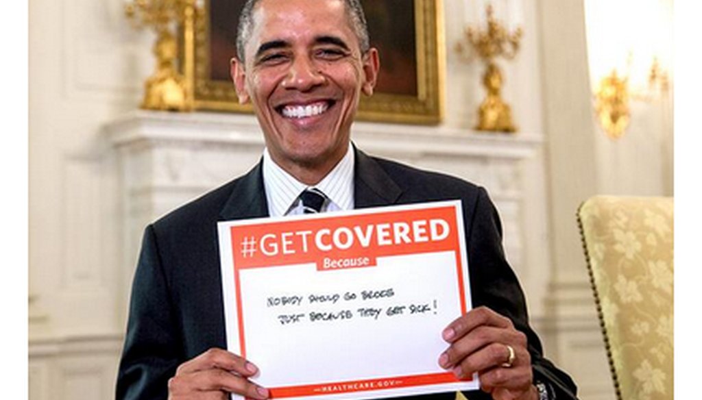 The White House on Dec. 12, 2013, tweeted this picture of President Barack Obama holding a sign urging Americans to get health coverage “because nobody should go broke just because they get sick.” 