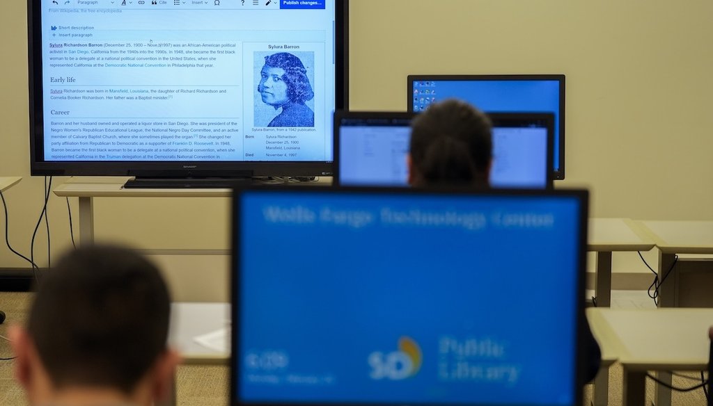 Pages on Wikipedia are displayed on screens as people edit, Feb. 26, 2024, at the main library in San Diego. (AP)