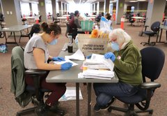 Split in voting methods puts COVID, mail center stage in Wisconsin