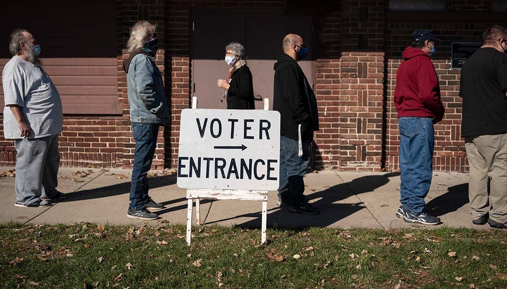 Voters wait in line Nov. 3, 2020, Election Day, outside a polling center in Kenosha, Wis. (AP)