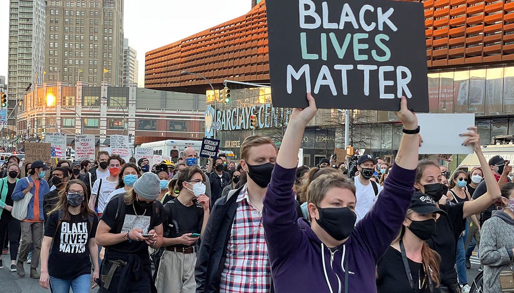 Demonstrators walk carry signs in Brooklyn, N.Y., after former Minneapolis, police officer Derek Chauvin was found in the murder of George Floyd. “Woke” was a label some social justice activists adopted during the Black Libes Matter and Me Too Movements.