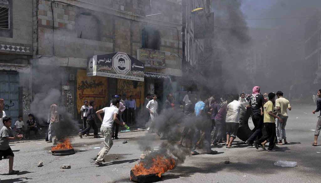 Anti-government protesters clash with Yemeni security forces in Taiz in 2011.              