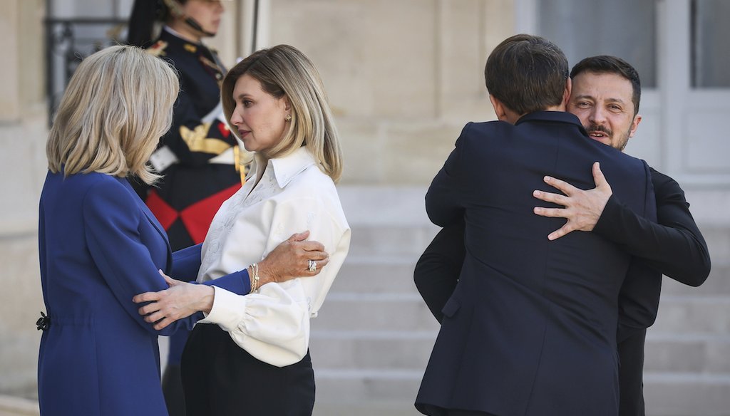 Ukrainian President Volodymyr Zelenskyy, right, and his wife Olena Zelenska, third right, are welcomed by French President Emmanuel Macron and his wife Brigitte Macron,  June 7, 2024 at the Elysee Palace in Paris. (AP)
