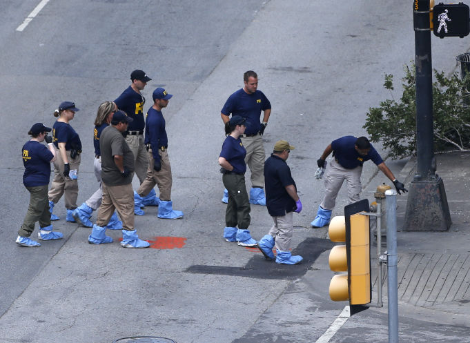 An FBI evidence response team works the crime scene, Sunday where five Dallas police officers were killed Thursday in Dallas. (AP)