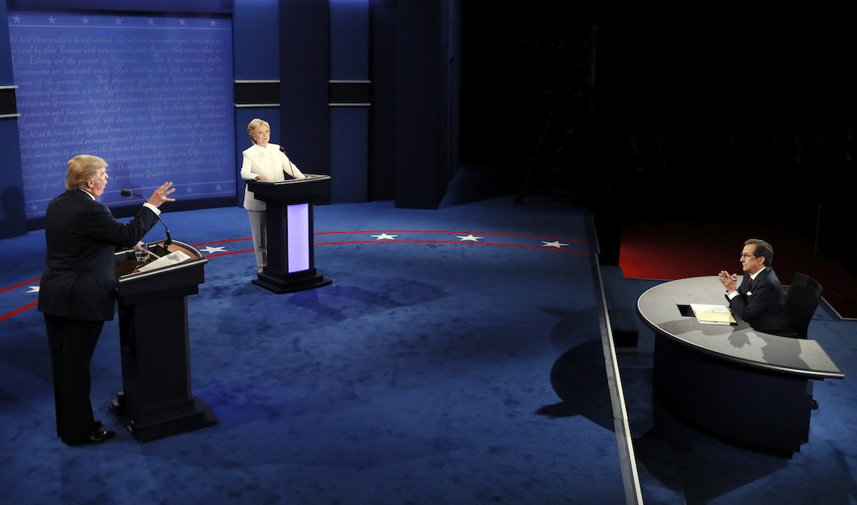Moderator Chris Wallace questions Democratic presidential nominee Hillary Clinton and Republican presidential nominee Donald Trump during the third presidential debate at UNLV in Las Vegas, Wednesday, Oct. 19, 2016. (Mark Ralston/Pool via AP)