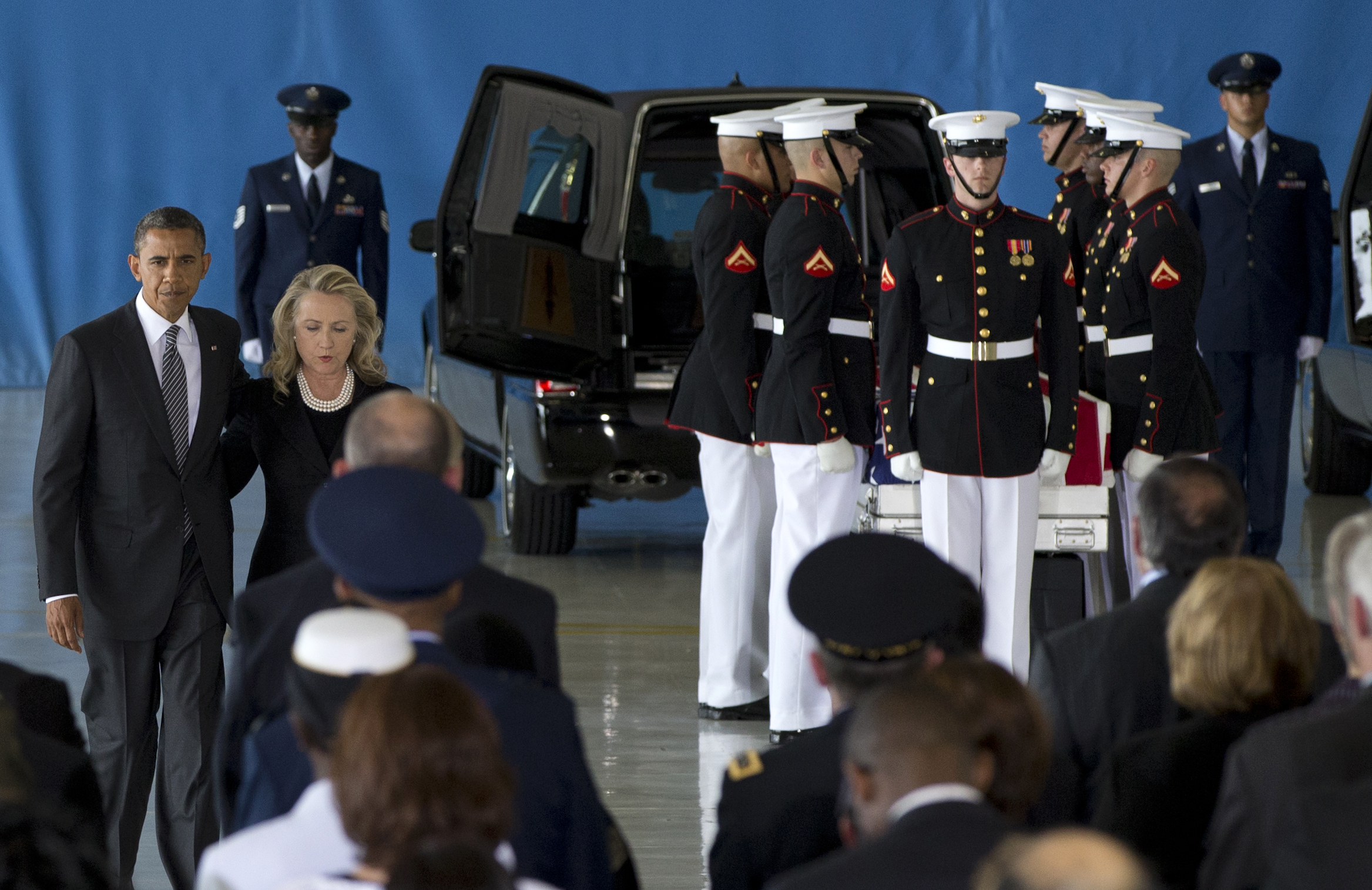 President Obama and then-Secretary of State Hillary Clinton walk back to their seats after speaking at a transfer of remains ceremony for the Benghazi victims Sept. 14, 2012, at Joint Base Andrews. (AP Photo)