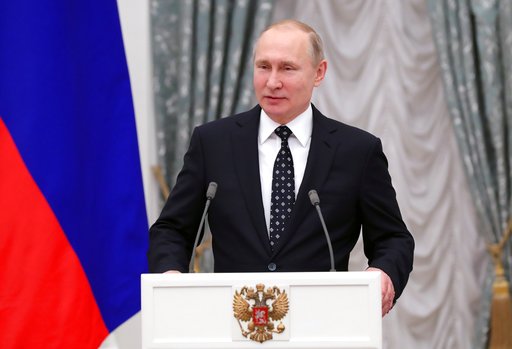 Russian President Vladimir Putin speaks at the Kremlin in Moscow, March 20, 2018. (Mikhail Klimentyev, Sputnik, Kremlin Pool Photo via AP).
