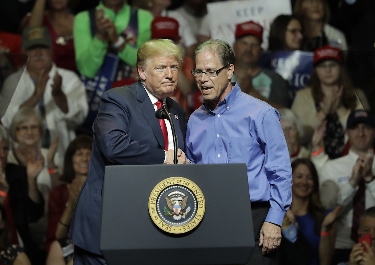 Mike Braun, the Indiana GOP Senate candidate, celebrates his victory with President Donald Trump on May 10, 2018.