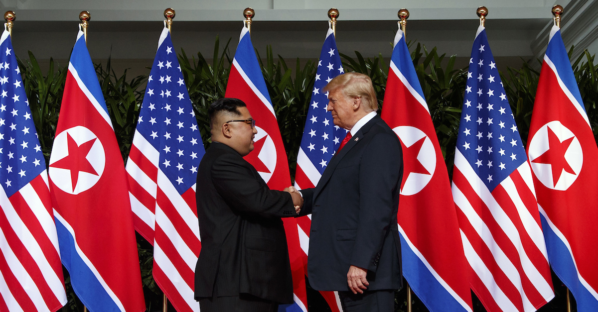 North Korean leader Kim Jong Un and U.S. President Donald Trump shake hands prior to their meeting on Sentosa Island in Singapore on June 12, 2018. (AP)