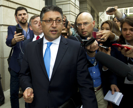 Assistant Attorney General for Antitrust Makan Delrahim leaves the federal courthouse Tuesday, June 12, 2018, in Washington (AP Photo/Jose Luis Magana).