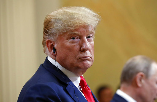 President Donald Trump looks over as he listens to Russian President Vladimir Putin speak during their joint news conference in Helsinki, Finland, on July 16, 2018. (AP/Pablo Martinez Monsivais)
