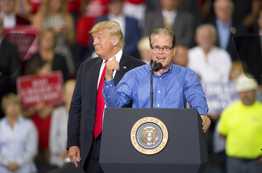 Mike Braun, Republican candidate for the U.S. Senate, thanks President Donald Trump for his endorsement during a campaign rally at the Ford Center on Aug. 30, 2018, in Evansville, Ind. (AP)
