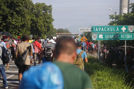 Central American migrants walk north toward Tapachula, after departing Ciudad Hidalgo, Mexico, Sunday, Oct. 21, 2018. (AP Photo/Moises Castillo)