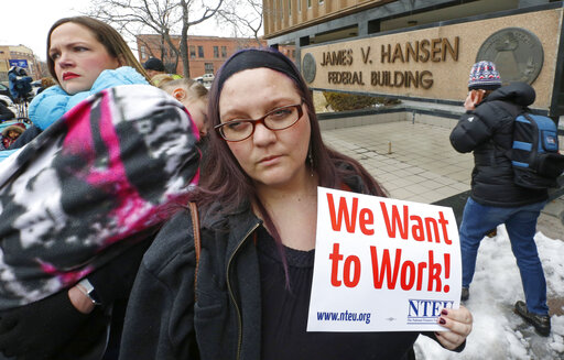 IRS worker Christine Helquist joins other federal workers rallying outside the Federal Building in Ogden, Utah, on Jan. 10, 2019, as a government shutdown continued. (AP)
