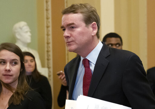 Sen. Michael Bennet, D-Colo., leaves the chamber after an emotional speech on the Senate floor over the partial government shutdown, at the Capitol in Washington, Thursday, Jan. 24, 2019. (AP Photo/J. Scott Applewhite)