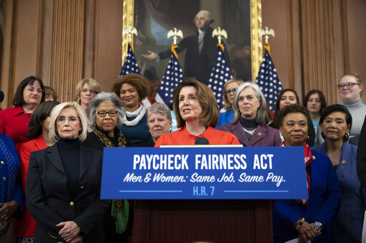 Speaker of the House Nancy Pelosi, D-Calif., joined at left by Lilly Ledbetter, an activist for workplace equality, speaks at an event to advocate for the Paycheck Fairness Act, Jan. 30, 2019. (AP Photo/J. Scott Applewhite)