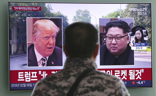 A man in Seoul, South Korea, watches a TV screen showing President Donald Trump and North Korean leader Kim Jong Un on Feb. 9, 2019. (AP)