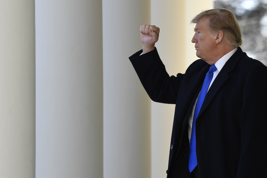 President Donald Trump gestures to the audience as he heads to the Oval Office after speaking during an event in the Rose Garden at the White House on Feb. 15, 2019, to declare a national emergency in order to build a wall. (AP)