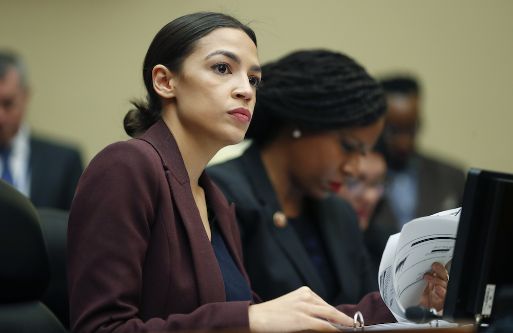 Rep. Alexandria Ocasio-Cortez, D-N.Y., looks over her notes during testimony by Michael Cohen before the House Oversight and Reform Committee on Feb. 27, 2019. (AP)