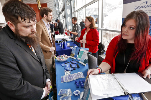 Visitors to a Pittsburgh veterans job fair meet with recruiters at Heinz Field on March 7, 2019. (AP)
