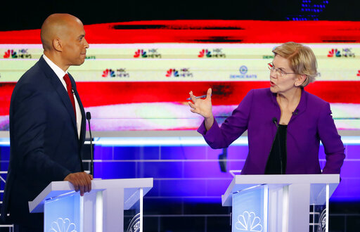 Democratic presidential candidates Elizabeth Warren and Cory Booker both criticized the state of the economy during a Democratic primary debate on June 26, 2019. (AP)