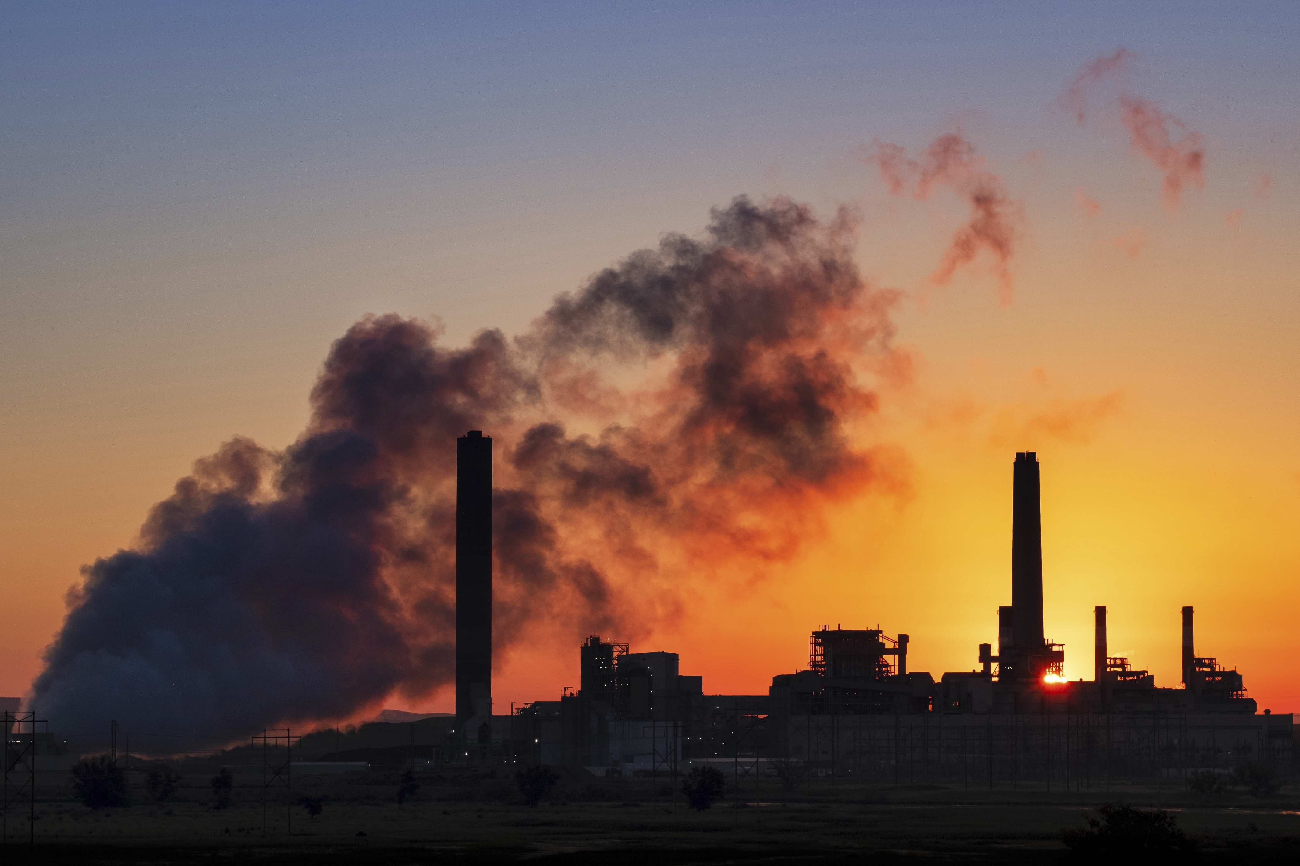 In this July 27, 2018, file photo, the Dave Johnson coal-fired power plant is silhouetted against the morning sun in Glenrock, Wyo. (AP)
