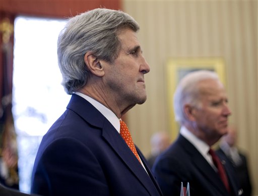 Former Secretary of State John Kerry and Vice President Joe Biden listen to President Barack Obama answer questions on Ukraine on March 3, 2014, at the White House in Washington. (AP/Monsivais)