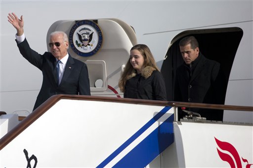 Then-Vice President Joe Biden arrives on Air Force Two in Beijing, China, with his son Hunter Biden and his granddaughter Finnegan Biden on Dec. 4, 2013. (AP)